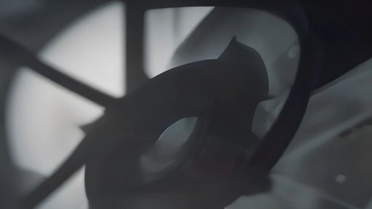 Close-up of cooling fans on a mining rig with hard directional light and deep shadows